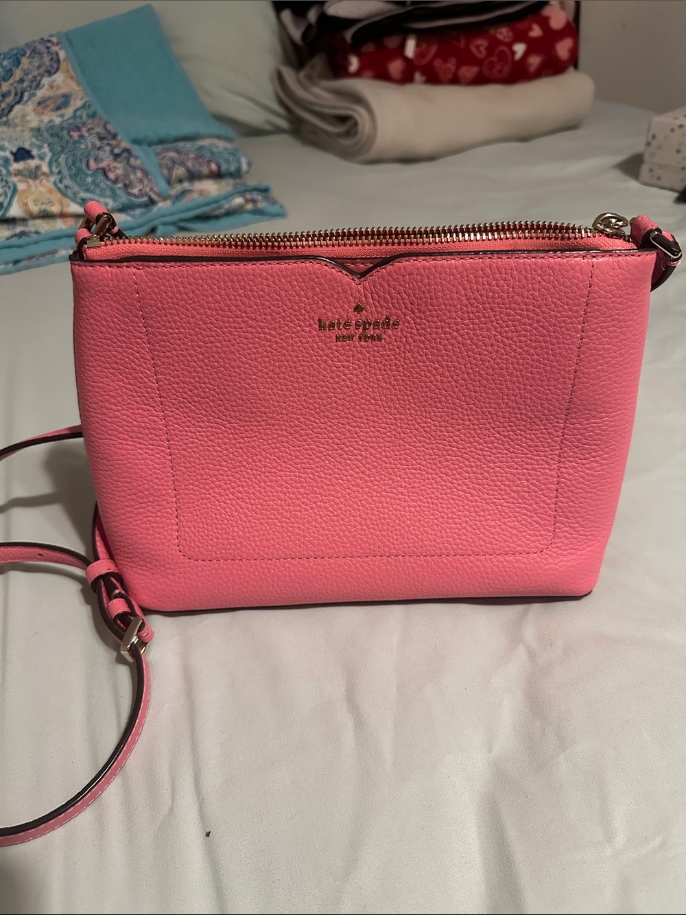 kate spade pebbled leather crossbody in bright pink with gold hardware